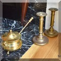 D10. Brass fire lighter and candlesticks. 